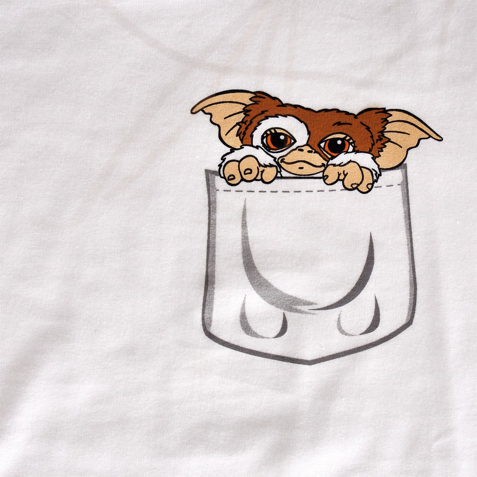Immagine del prodotto Gremlins - T-shirt da donna bianca con Gizmo in tasca