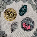 Immagine del prodotto Casa del Drago - Set di 4 spille simbolo