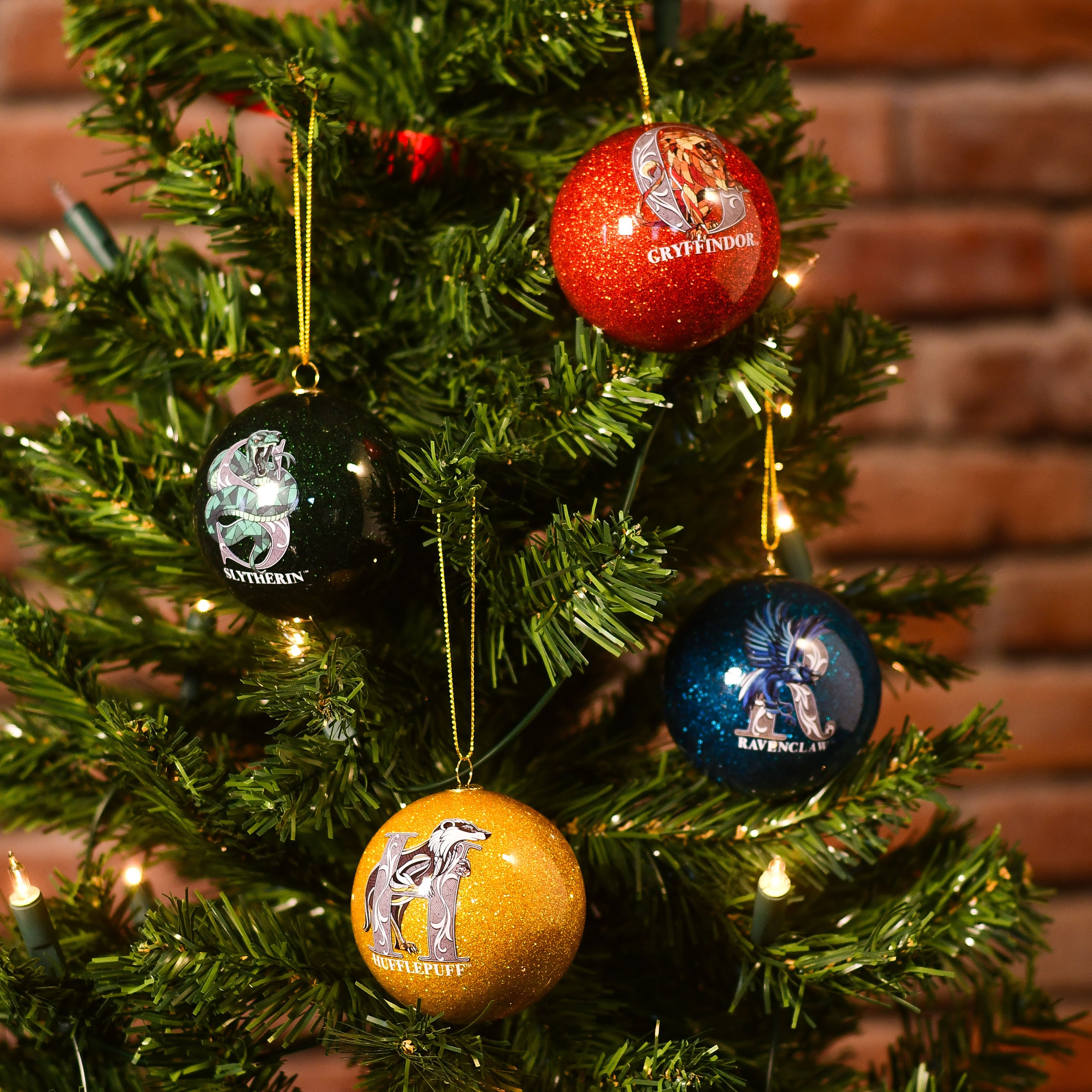 Immagine del prodotto Harry Potter - Ornamenti per albero di Natale con stemmi delle case, set da 4