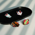 Immagine del prodotto Demon Slayer - Set di pin con simboli (4 pezzi)