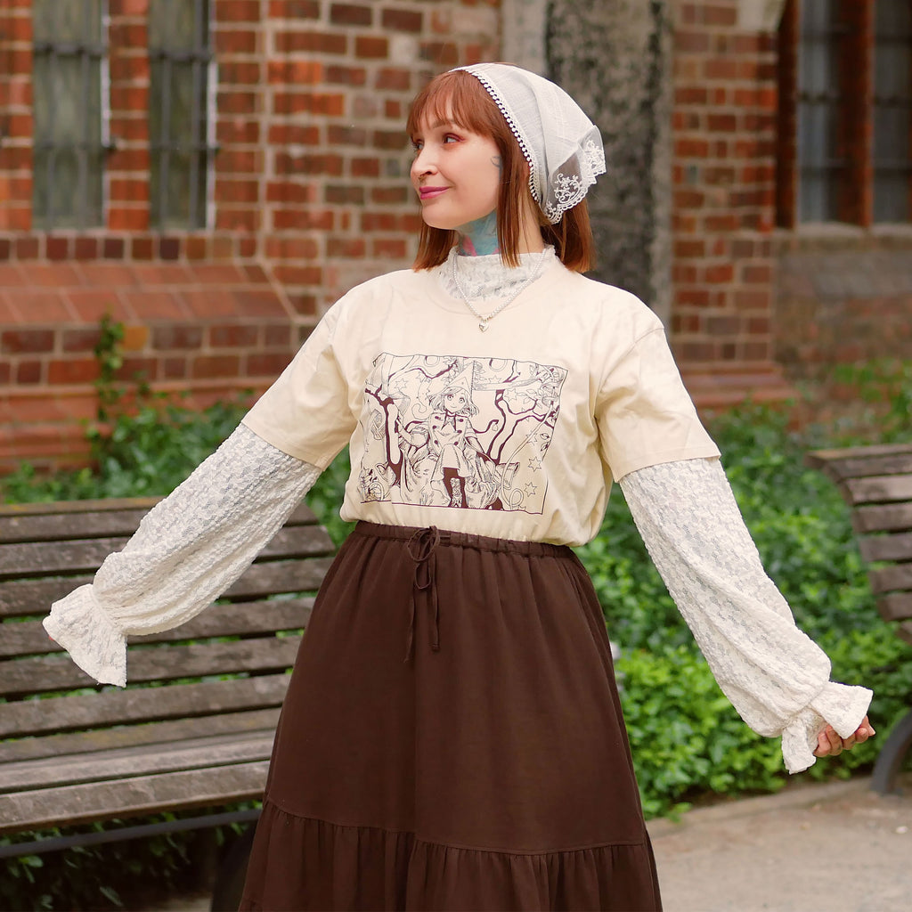 Immagine del prodotto T-shirt beige per fan di Coco e Atelier of Witch Hat