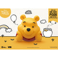 Immagine del prodotto Winnie the Pooh Piccolo salvadanaio in vinile Winnie sdraiato 17 cm
